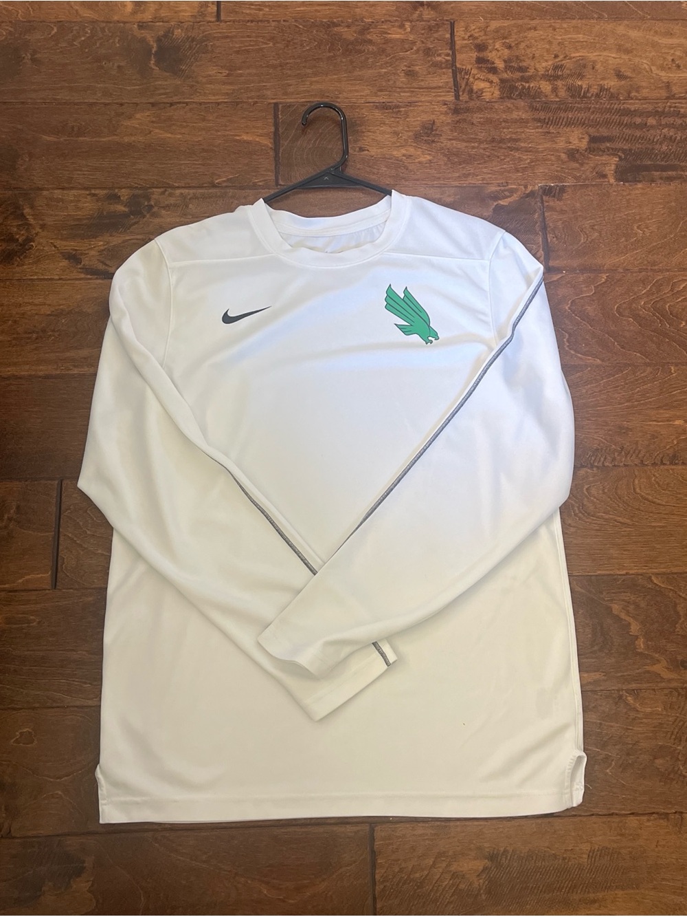 Nike White Long-Sleeve Athletic Top with Green Emblem